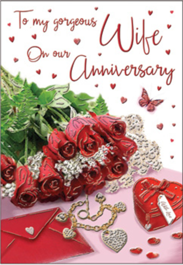 The image presents an anniversary card styled with the romantic richness of a floral still life, reminiscent of a carefully dressed mantelpiece in a Wandsworth townhouse. At the centre, a compact bouquet of classic red roses commands attention, each flower luxuriantly full, with curved petals that create a deep, velvety whirl of colour. The roses sit cradled in fresh greenery, slender stems and leaves arching outward to frame the blooms, adding flashes of cool, natural green that heighten the intensity of the red. Just beside the flowers lies a pristine envelope, its surface smooth and slightly luminous in the soft light, suggesting an awaiting love note or anniversary message. A small heart-shaped box, polished and richly coloured, is positioned close to a piece of jewellery that glints with subtle highlights, like a necklace or keepsake gifted to commemorate another year together. Scattered across the background are tiny hearts and sparkling accents, some resting close to the roses, others drifting toward the edges of the card, creating a sense of quiet celebration spreading outwards. A graceful butterfly illustration hovers nearby, wings gently outstretched, adding an airy, whimsical detail that contrasts with the solid, grounded roses. The overall palette of scarlet, cream, and warm metallic tones is softened by gentle, directional lighting, as though the card were placed near a window facing Wandsworth Common, where daylight falls in delicate bands. The composition feels both intimate and timeless, crafted with the sensitivity of an experienced florist who understands how flowers, keepsakes, and a few carefully chosen details can echo the feeling of an anniversary bouquet delivered to someone cherished across SW18.