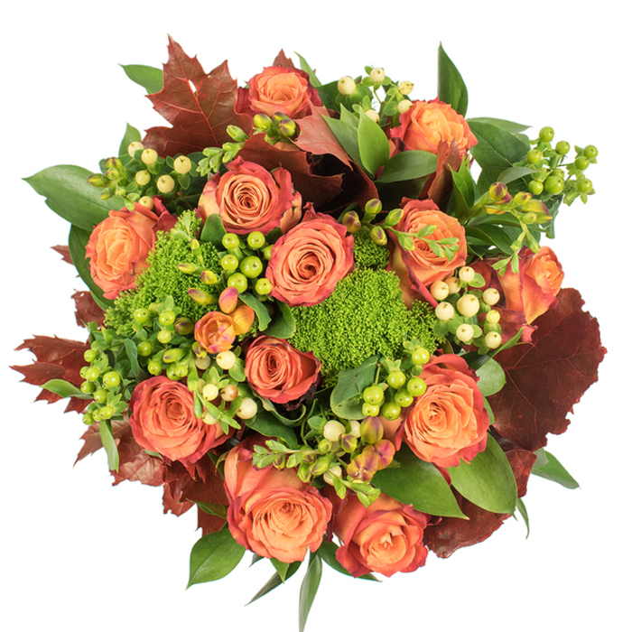 Photographed from above on a clean white field, this artful autumn bouquet reads like a small, cultivated patch of countryside brought indoors - something you might spot on a café table by Wandsworth's Southside or beside a window overlooking the Common. At its centre, a ring of full roses blooms in warm, sunset shades: gentle peach near the centre, moving through coral to a robust orange and finally tinges of russet and reddish-brown at the petal edges, echoing the trees as September turns to October. Nestled between these classic blooms are clusters of Hypericum berries - some sharp lime green, others a pale cream - whose round, waxy forms introduce a playful, tactile rhythm. The eye is drawn to the unexpected presence of Green Trick dianthus: small, vivid green pom-poms that resemble moss or miniature broccoli heads, bringing a plush, almost furry texture that contrasts with smooth rose petals. Broad, glossy green foliage and larger lobed leaves in dark burgundy provide structure and a sense of abundance, their tones reinforcing the arrangement's harvest mood. Under soft, even light the bouquet's surfaces - matte velvets, glossy berries, and textured greens - are clearly legible, creating a sensory impression of warmth, gentle fragrance, and handcrafted care. Ideal as a centrepiece for a cosy supper, a thoughtful seasonal gift for a Wandsworth neighbour, or an autumnal accent for home décor, this composition balances colour, texture and emotional warmth.
