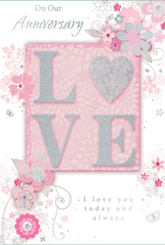 The anniversary card in this image feels like a paper bouquet, thoughtfully composed in the same way a Wandsworth florist might build a romantic arrangement for a long-married couple. The entire design leans into a soft palette of blush pinks, pearly whites, and gentle silvers, with the background tinted in a warm, powdery pink that sets a calm and loving mood. In the centre, the word LOVE appears in large, raised letters, coated with a delicate layer of glitter that looks almost frosted, as though touched by early morning light along the Thames. The letters are bold yet tender, their sparkling texture inviting a slow, appreciative touch. Flowing around this central word, a ring of stylised flowers, leaves, and curling tendrils spreads gracefully across the card. Each bloom is finely outlined, with shading that suggests layered petals and soft, velvety textures, reminiscent of roses and other dainty blossoms you might see arranged in a shop near Wandsworth Town station. Silver accents wink subtly among the petals, tracing outlines and tiny details like veins on leaves. These floral motifs seem to drift outward, giving the sense of movement and lightness, while still holding the composition together like a carefully balanced bouquet. Along the top and lower portion of the card, an anniversary message is written in elegant, scripted typography, its thin, looping strokes echoing the curves of the surrounding vines. The overall effect is romantic and tranquil, ideal for celebrating a special milestone with quiet sincerity, like sharing a lingering conversation at home after anniversary flowers have been delivered and placed in a favourite vase.